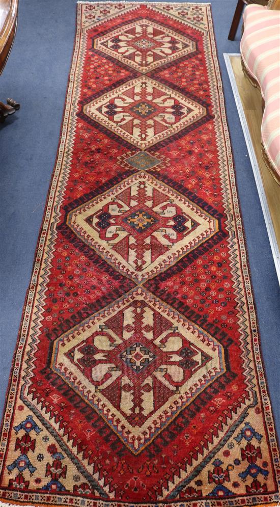 A Hamadan red ground runner, 9ft 3in by 2ft 8in.